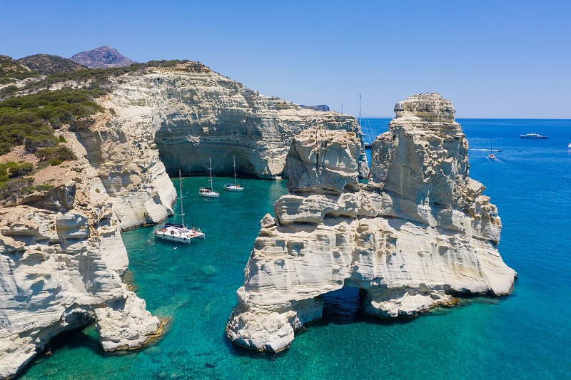 Sailing_yachts_near_the_caves_at_Kleftiko_on_Milos_Island,_Greece.jpg